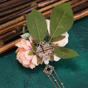 Detail view of the Hanfu artificial flower hair clip, showing back spring clip and tassel.