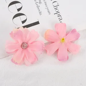 Artificial pink silk flower heads for DIY crafts, wedding decor, and photography props.