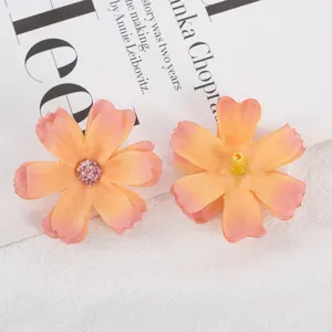 Artificial six-petal silk flower head detail, DIY craft material, orange gradient color.