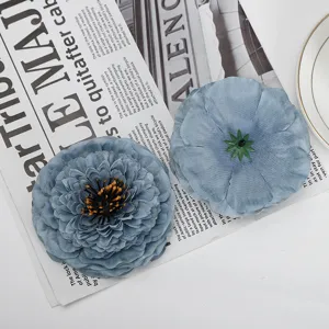 Blue artificial chrysanthemum detail, close-up of decorative silk flower ornament display.