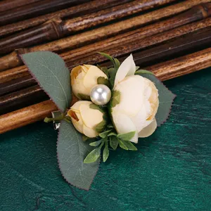 Charming artificial champagne rose flower hair clip with pearl detail, elegant floral accessory.