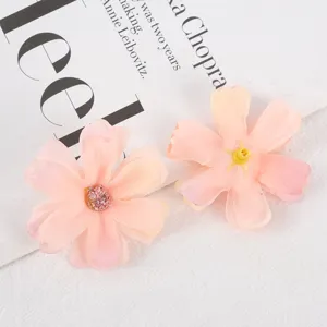 Detailed close-up of pink artificial silk flower heads, perfect for DIY crafts and wedding decor.