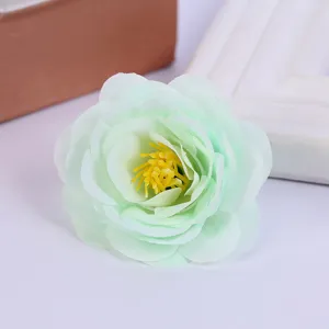 Artificial green rose flower head for home decor, wedding photography and floral crafts.