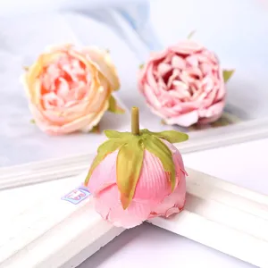 Artificial silk rose flower head detail closeup for home decor and photography props.