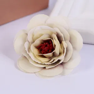 Artificial rose flower head detail shot, perfect for home decor, wedding photography props.