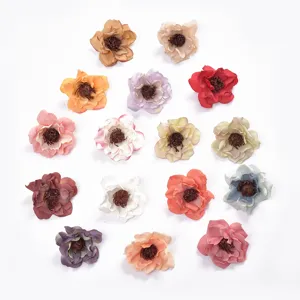 Detail view of assorted colored artificial flower heads, perfect for DIY crafts and home decor.