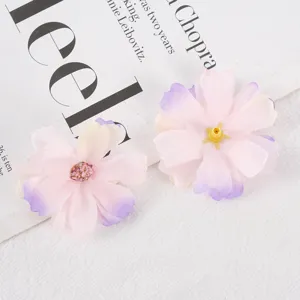 Artificial silk flower head detail, pink gradient multi-layered DIY craft floral decor ornament.