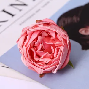 Pink artificial rose flower head detail, ideal for home decor, wedding floral props and crafts.