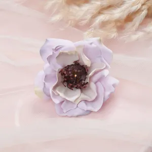Detailed view of artificial peony flower with delicate petals and rich stamens for home decor.