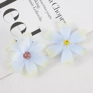 Artificial silk flower heads multi-layer blue DIY floral decor for wedding photography detail.