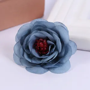Blue artificial rose flower head detail shot for home decor, wedding props and floral crafts.