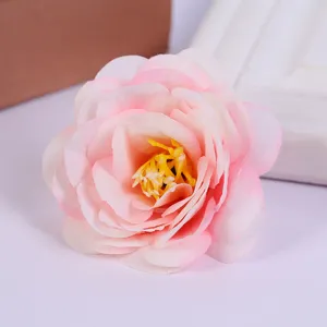 Artificial pink rose flower head for home decor, wedding photography, and DIY crafts.