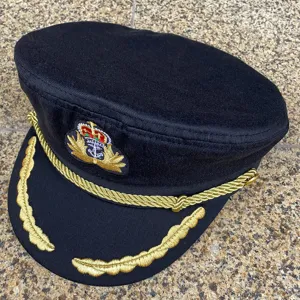 Detailed view of the black military cap with gold embroidery, classic peaked officer hat for men.