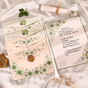 Vintage floral stationery set with envelopes, letter paper, and clover design for romantic love letters.
