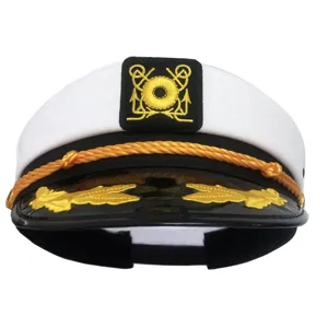 White yacht captain hat detail, featuring gold embroidery, black visor and decorative rope.