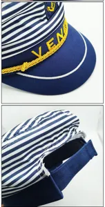 Detail view of blue white striped sailor hat with gold embroidery front patch and back strap