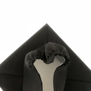 Black graduation cap detail view, premium fabric mortarboard for academic ceremonies.