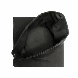 Black graduation cap detail view, classic mortarboard inner structure and fabric close up.