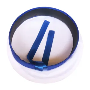 Detail shot of the white sailor cap featuring blue ribbon and trim, classic marine style.