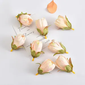 Close-up detail of artificial tulip flower heads, soft pink petals for creative handmade crafts.