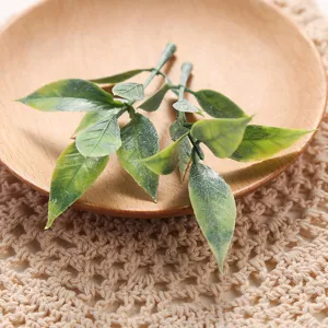 Artificial green plant leaf detail shot showing realistic texture and natural gradient color design.