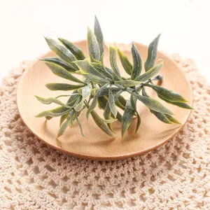 Artificial green plant leaves detail shot, Nordic style home balcony decoration ornament.