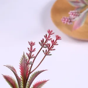 Detailed view of artificial decorative plant leaves, perfect for home and wedding floral arrangements.
