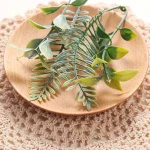 Artificial green leaves detail shot, perfect for home decor, floral arrangement, and DIY crafts.