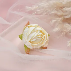 Close-up detail of artificial cream white flower head for DIY home decor and wedding crafts.