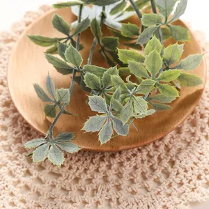 Artificial green plant leaves decoration for home balcony living room decor indoor plants.