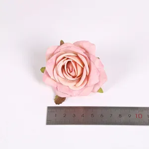 Künstlicher Rosenblütenkopf für Hochzeitsdekoration und Heimtextilien, rosa Kunstblume Fotografie.