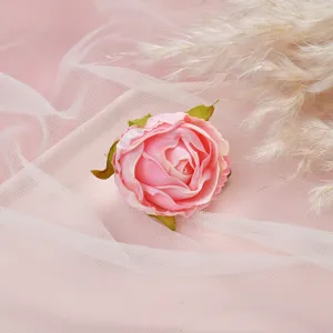Close-up detail shot of pink artificial flower head for DIY craft and home decoration settings.