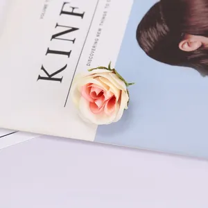 Artificial silk rose flower head detailed close up shot for wedding craft photography prop.