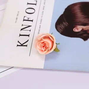 Artificial peach rose flower head simulation silk flower for photography prop and home decor.