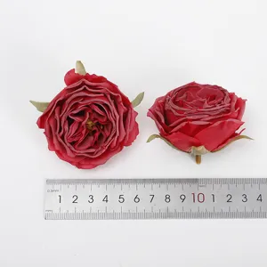 Close-up detail of artificial red rose flower heads for floral arrangements and crafts.