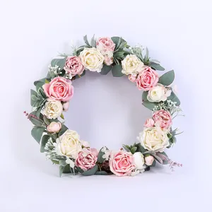 Artificial rose flower wreath detail, pink and white faux floral hanging for home decor.