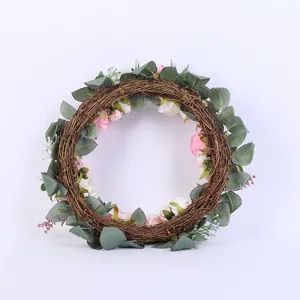 Artificial rose wreath detail view, perfect for festive door hanging and wedding decor setup.