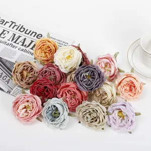 Close up of colorful artificial rose flower heads for floral arrangements and home decor details.