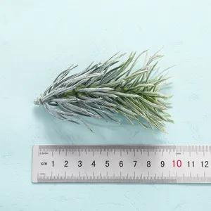 Artificial green plant leaf detail, frosted pine needle branch for home decor and display.