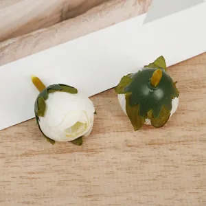 Close-up detail shot of artificial white rose flower buds, perfect for DIY craft floral accessories.