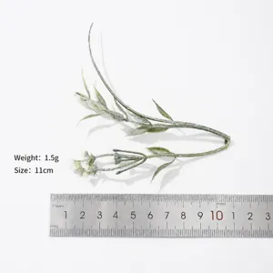 Close up detail view of artificial miniature flower branch for DIY crafts with size scale.