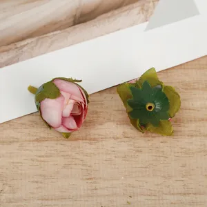 Close-up of artificial rose flower heads, perfect for DIY crafts and floral arrangements.