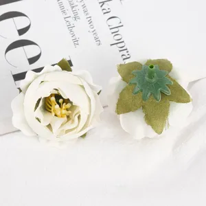 Close up detail view of white artificial rose flower heads, fabric material for craft DIY.
