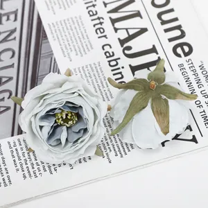 Close-up of artificial rose flower head, realistic fabric material for floral decor and wedding.