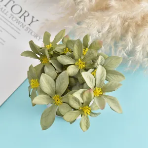 Detailed view of artificial green flower heads with bright yellow stamens for DIY crafts.