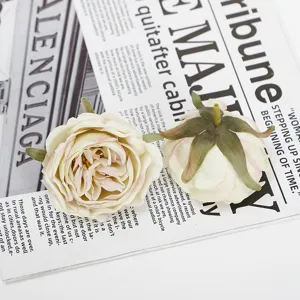 Detailed close-up view of artificial rose flower heads with burnt edges for floral arrangements.