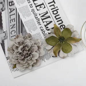Detail view of artificial peony flower head, silk fabric floral decor for DIY home arrangement.