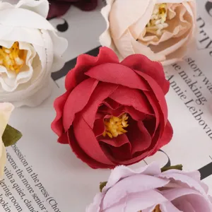Artificial fabric rose flower heads for DIY crafts, wedding decoration and apparel accessories.