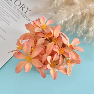 Artificial silk flower head detail, pink floral material for DIY crafts and photography props.