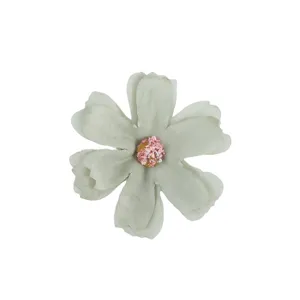 Detail view of multi-layered artificial silk flower head, six-petal DIY wedding decor prop.